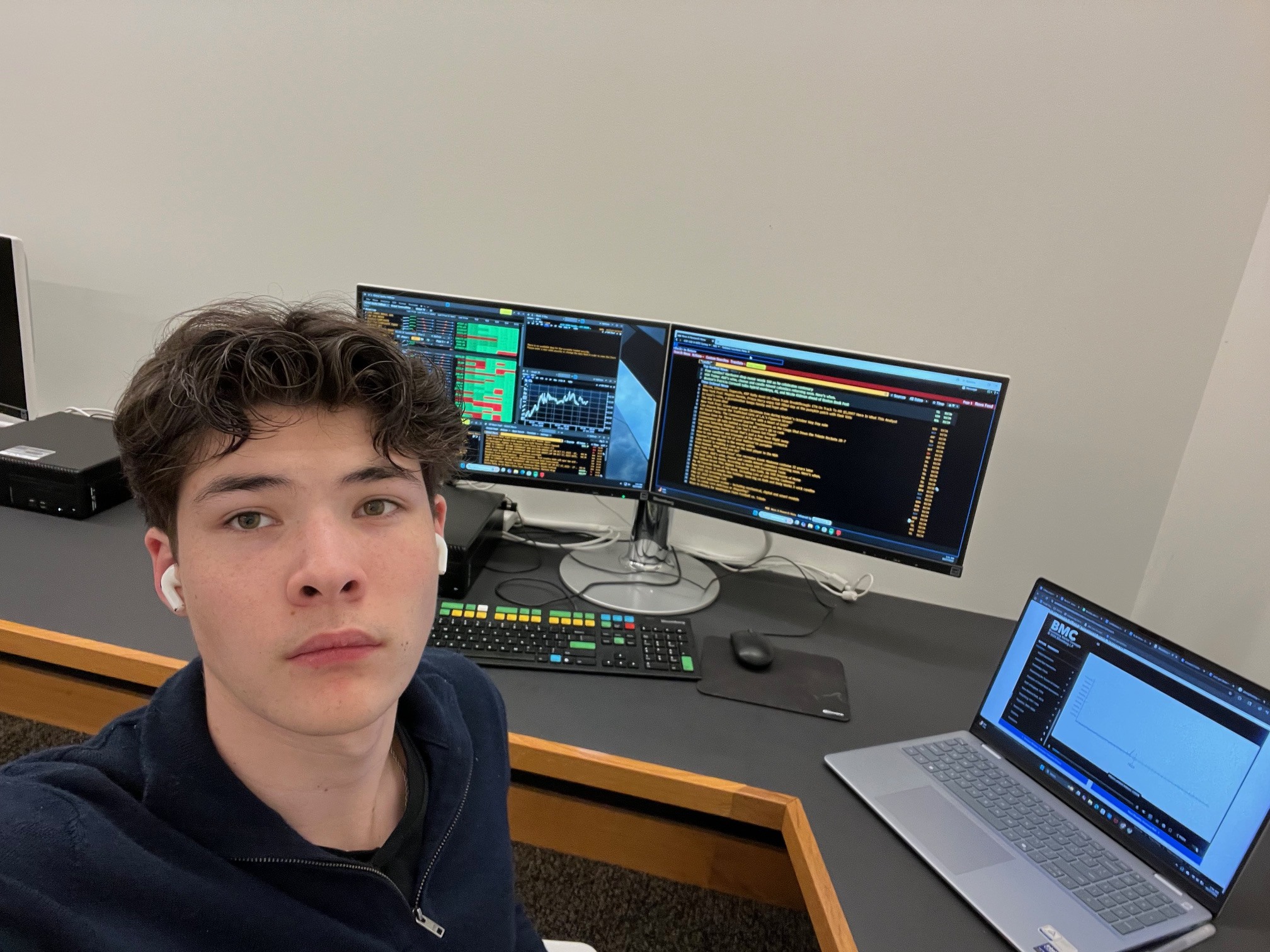 At a Bloomberg terminal desk with dual monitors